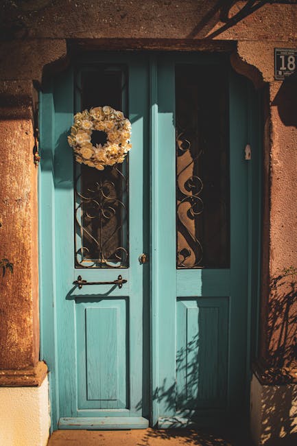 Teal ornate door representing access to support